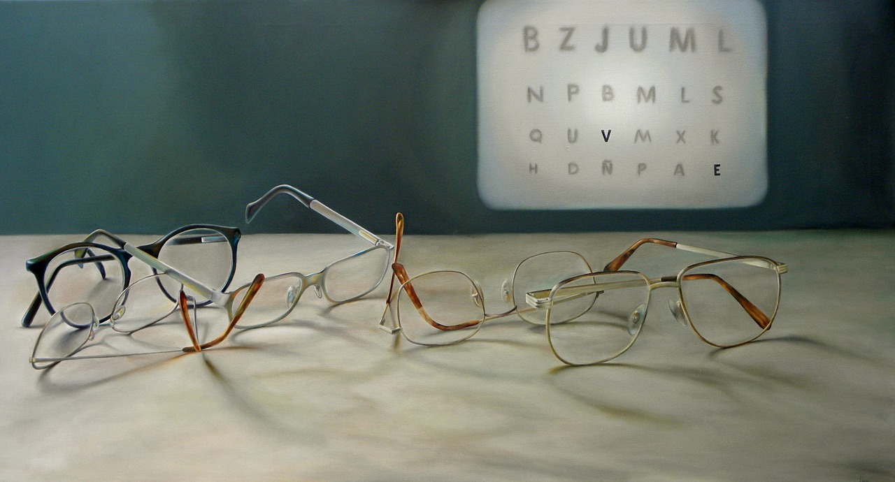 Eyeglasses in front of the laser eye doctor's eye chart for eye exams in Virginia