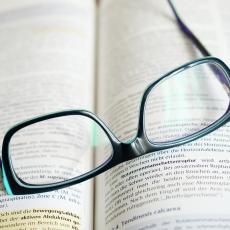 Reading glasses on an open book